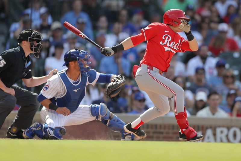 May 31, 2024; Chicago, Illinois, USA; Cincinnati Reds outfielder TJ Friedl (29) hits an RBI single during the ninth inning against the Chicago Cubs at Wrigley Field. Mandatory Credit: Melissa Tamez-USA TODAY Sports