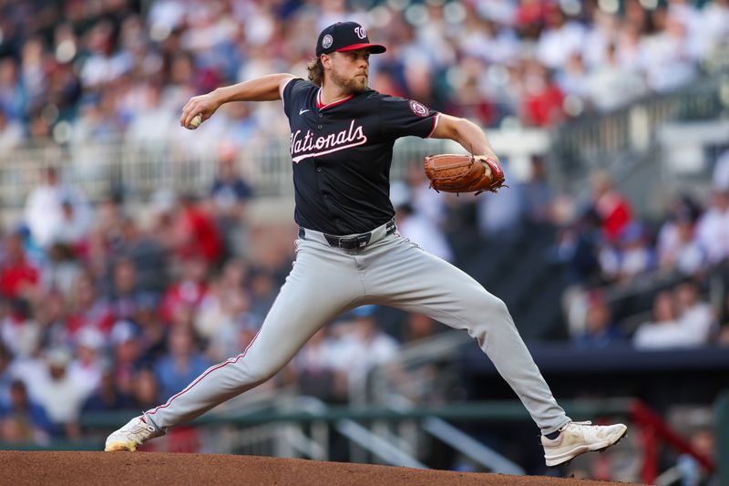 May 12, 2025; Atlanta, Georgia, USA; Washington Nationals starting pitcher Jake Irvin (27) throws against the Atlanta Braves in the first inning at Truist Park. Mandatory Credit: Brett Davis-Imagn Images