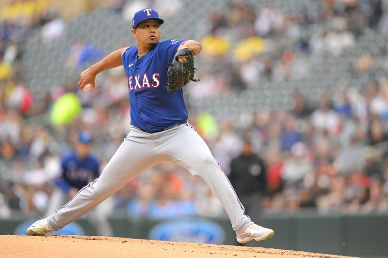 May 26, 2024; Minneapolis, Minnesota, USA;  Texas Rangers pitcher Gerson Garabito (58) delivers a pitch against the Minnesota Twins during the first inning at Target Field. Mandatory Credit: Nick Wosika-USA TODAY Sports