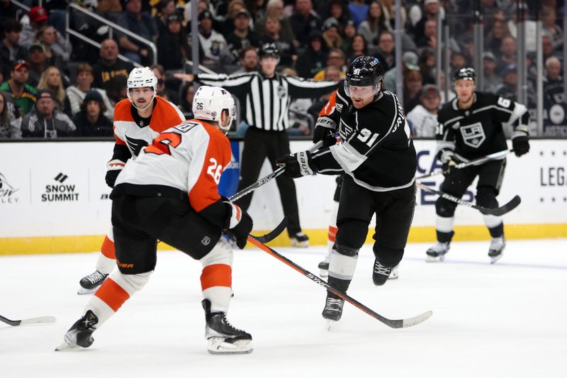 Nov 11, 2023; Los Angeles, California, USA;  Los Angeles Kings right wing Carl Grundstrom (91) scores a goal during the second period against the Philadelphia Flyers at Crypto.com Arena. Mandatory Credit: Kiyoshi Mio-USA TODAY Sports