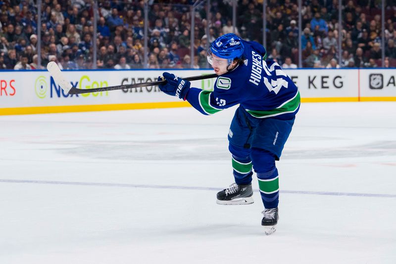 Jan 24, 2024; Vancouver, British Columbia, CAN; Vancouver Canucks defenseman Quinn Hughes (43) shoots against the St. Louis Blues in the third period at Rogers Arena. Blues 4-3 in overtime. Mandatory Credit: Bob Frid-USA TODAY Sports