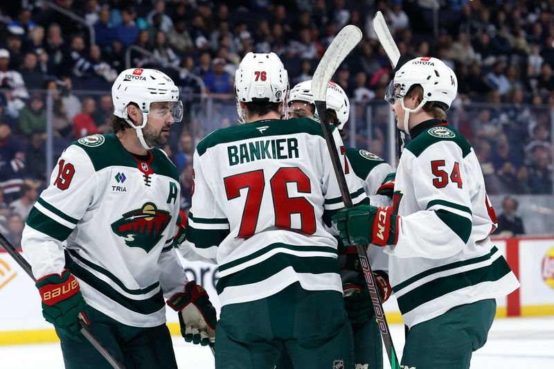 Sep 21, 2024; Winnipeg, Manitoba, CAN; Minnesota Wild Forward Cedar Banker (76) celebrates his first period goal against the Winnipeg Jets at Canada Life Centre. Mandatory Credit: James Carey Lauder-Imagn Images