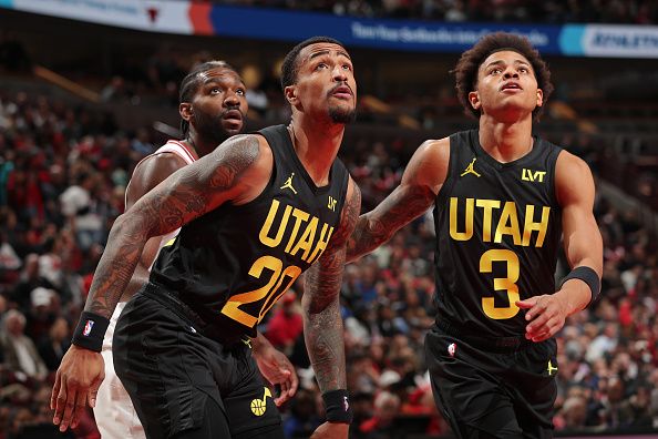 CHICAGO, IL - NOVEMBER 6: John Collins #20 and Keyonte George #3 of the Utah Jazz wait for a rebound during the game against the Chicago Bulls on November 6, 2023 at the United Center in Chicago, Illinois. NOTE TO USER: User expressly acknowledges and agrees that, by downloading and or using this Photograph, user is consenting to the terms and conditions of the Getty Images License Agreement. Mandatory Copyright Notice: Copyright 2023 NBAE (Photo by Gary Dineen/NBAE via Getty Images).