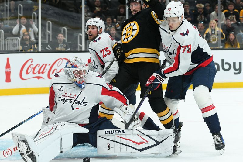 Sep 21, 2025; Boston, Massachusetts, USA; Washington Capitals goaltender Garin Bjorklund (68) makes a save in front of Boston Bruins left wing Tanner Jeannot (84) during the third period at TD Garden. Mandatory Credit: Bob DeChiara-Imagn Images