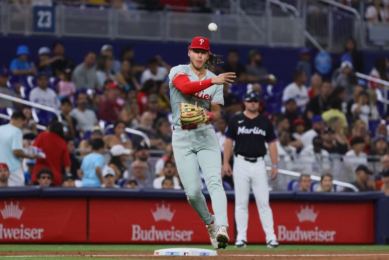 May 10, 2024; Miami, Florida, USA; Philadelphia Phillies third baseman Alec Bohm (28) throws to first base to retire Miami Marlins shortstop Tim Anderson (not pictured) during the second inning at loanDepot Park. Mandatory Credit: Sam Navarro-USA TODAY Sports