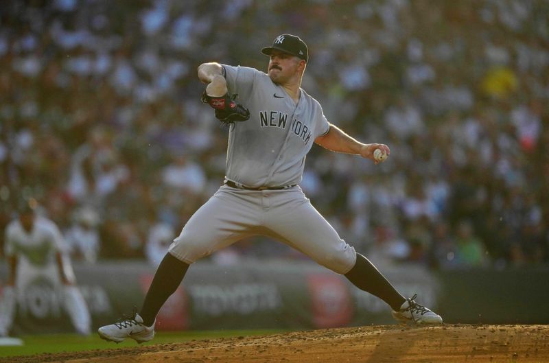 Jul 14, 2023; Denver, Colorado, USA; New York Yankees starting pitcher Carlos Rodon (55) pitches in fourth inning against the Colorado Rockies at Coors Field. Mandatory Credit: Ron Chenoy-USA TODAY Sports