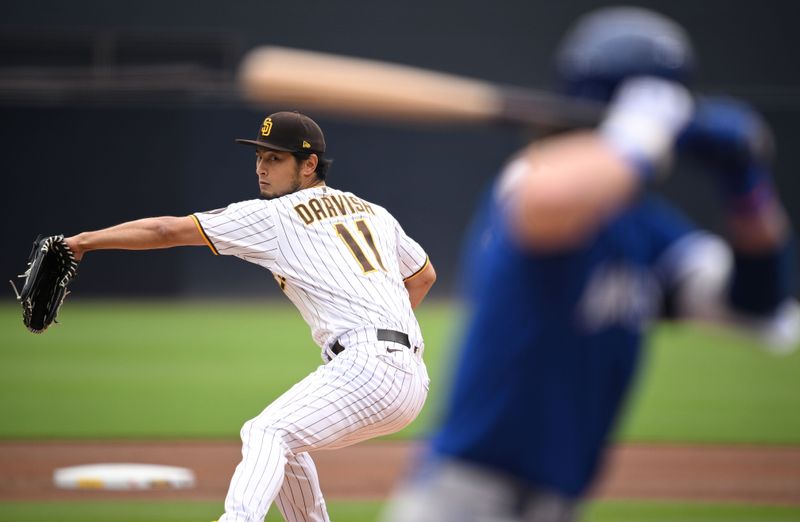 May 17, 2023; San Diego, California, USA; San Diego Padres starting pitcher Yu Darvish (11) throws a pitch against the Kansas City Royals during the first inning at Petco Park. Mandatory Credit: Orlando Ramirez-USA TODAY Sports