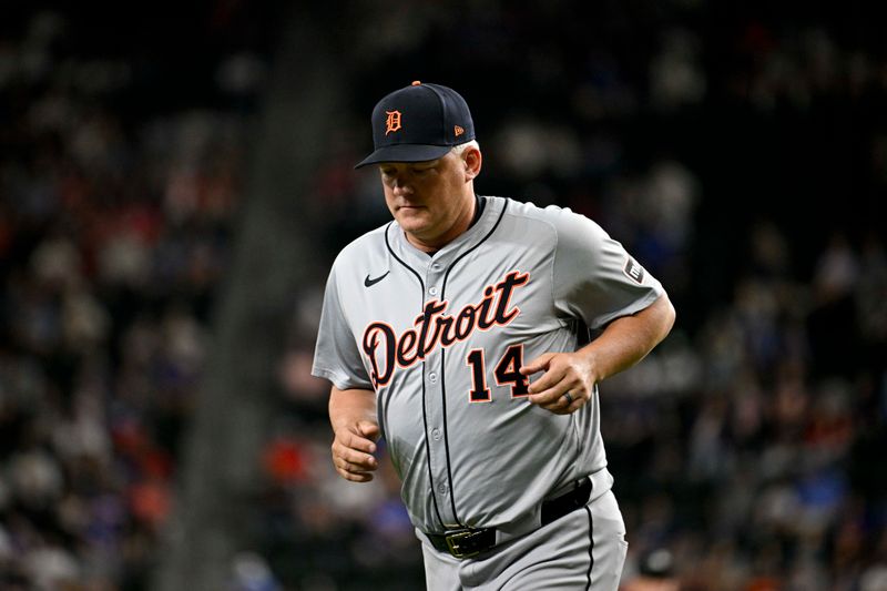 Jun 3, 2024; Arlington, Texas, USA; Detroit Tigers manager A.J. Hinch (14) runs back to the dugout during the ninth inning against the Texas Rangers at Globe Life Field. Mandatory Credit: Jerome Miron-USA TODAY Sports