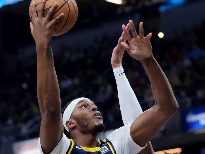 INDIANAPOLIS, INDIANA - FEBRUARY 22: Myles Turner #33 of the Indiana Pacers attempts a shot while being guarded by Cade Cunningham #2 of the Detroit Pistons in the first quarter at Gainbridge Fieldhouse on February 22, 2024 in Indianapolis, Indiana. NOTE TO USER: User expressly acknowledges and agrees that, by downloading and or using this photograph, User is consenting to the terms and conditions of the Getty Images License Agreement. (Photo by Dylan Buell/Getty Images)