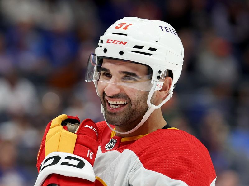 Nov 7, 2022; Elmont, New York, USA; Calgary Flames center Nazem Kadri (91) reacts during the first period against the New York Islanders at UBS Arena. Mandatory Credit: Brad Penner-USA TODAY Sports