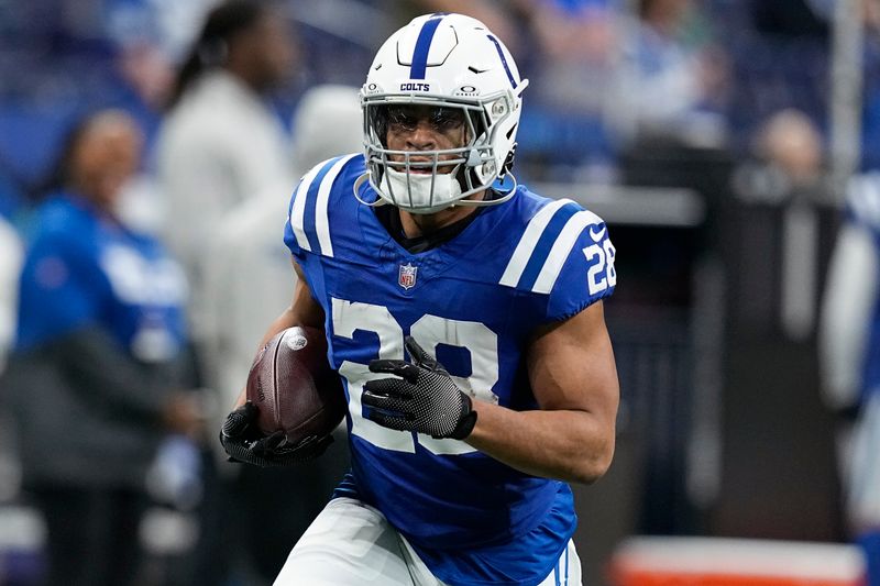 Indianapolis Colts running back Jonathan Taylor (28) warms up before an NFL football game against the Houston Texans, Saturday, Jan. 6, 2024, in Indianapolis. (AP Photo/Darron Cummings)