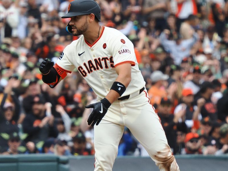 Aug 11, 2024; San Francisco, California, USA;  San Francisco Giants left fielder Michael Conforto (8) gestures to the Giants dugout after hitting a triple against the Detroit Tigers during the sixth inning at Oracle Park. Mandatory Credit: Kelley L Cox-USA TODAY Sports