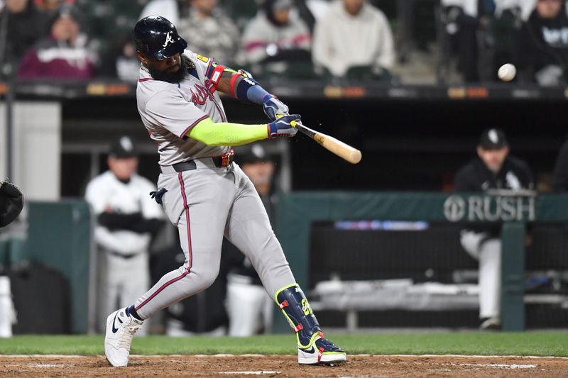 Apr 2, 2024; Chicago, Illinois, USA; Atlanta Braves designated hitter Marcell Ozuna (20) hits a solo home run during the ninth inning against the Chicago White Sox at Guaranteed Rate Field. Mandatory Credit: Patrick Gorski-USA TODAY Sports