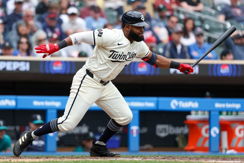 May 9, 2024; Minneapolis, Minnesota, USA; Minnesota Twins Manuel Margot (13) hits an RBI groundout against the Seattle Mariners during the fifth inning at Target Field. Mandatory Credit: Matt Krohn-USA TODAY Sports