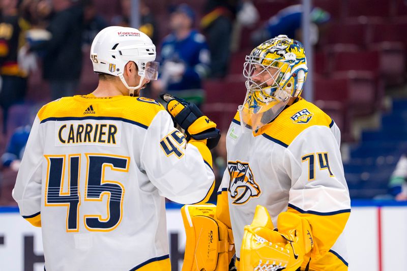 Apr 23, 2024; Vancouver, British Columbia, CAN;  Nashville Predators defenseman Alexandre Carrier (45) and goalie Juuse Saros (74) celebrate their victory against the Vancouver Canucks in game two of the first round of the 2024 Stanley Cup Playoffs at Rogers Arena. Mandatory Credit: Bob Frid-USA TODAY Sports