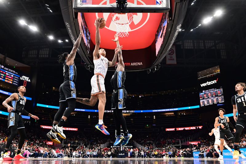 ATLANTA, GA - JANUARY 15: Jeremy Sochan #10 of the San Antonio Spurs drives to the basket during the game against the Atlanta Hawks on January 15, 2024 at State Farm Arena in Atlanta, Georgia.  NOTE TO USER: User expressly acknowledges and agrees that, by downloading and/or using this Photograph, user is consenting to the terms and conditions of the Getty Images License Agreement. Mandatory Copyright Notice: Copyright 2024 NBAE (Photo by Adam Hagy/NBAE via Getty Images)