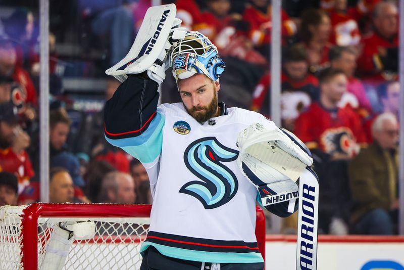 Dec 27, 2023; Calgary, Alberta, CAN; Seattle Kraken goaltender Chris Driedger (60) during the second period against the Calgary Flames at Scotiabank Saddledome. Mandatory Credit: Sergei Belski-USA TODAY Sports