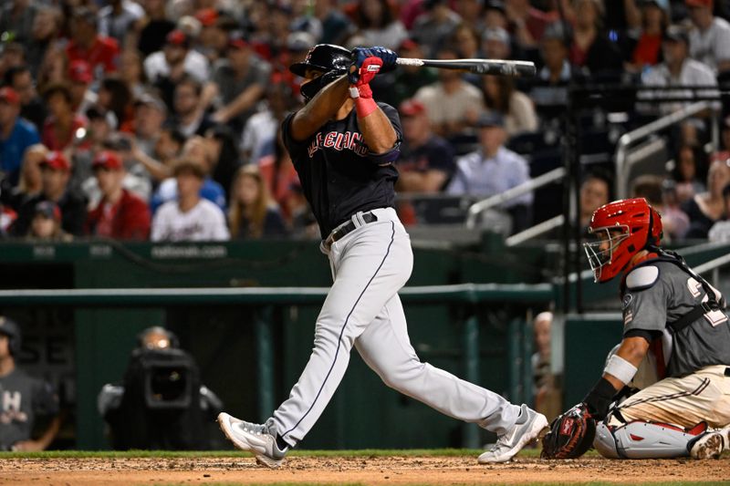 Apr 14, 2023; Washington, District of Columbia, USA; Cleveland Guardians shortstop Amed Rosario (1) hits a double against the Washington Nationals during the sixth inning at Nationals Park. Mandatory Credit: Brad Mills-USA TODAY Sports