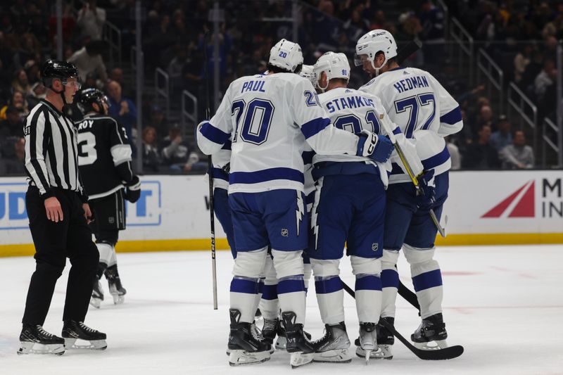 Mar 23, 2024; Los Angeles, California, USA; The Tampa Bay Lighting celebrate after Tampa Bay Lighting center Brayden Point (21) scores a goal during the first period of an NHL hockey game against the Los Angeles Kings at Crypto.com Arena. Mandatory Credit: Yannick Peterhans-USA TODAY Sports