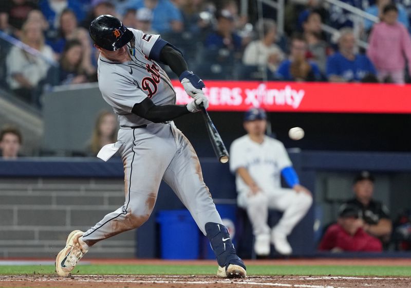 May 18, 2025; Toronto, Ontario, CAN; Detroit Tigers catcher Dillon Dingler (13) hits a single against the Toronto Blue Jays during the fourth inning at Rogers Centre. Mandatory Credit: Nick Turchiaro-Imagn Images