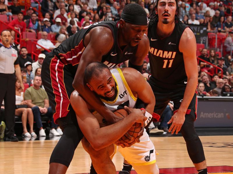 MIAMI, FL - MARCH 2: Bam Adebayo #13 of the Miami Heat and Talen Horton-Tucker #5 of the Utah Jazz fight for ball during the game on March 2, 2024 at Kaseya Center in Miami, Florida. NOTE TO USER: User expressly acknowledges and agrees that, by downloading and or using this Photograph, user is consenting to the terms and conditions of the Getty Images License Agreement. Mandatory Copyright Notice: Copyright 2024 NBAE (Photo by Issac Baldizon/NBAE via Getty Images)