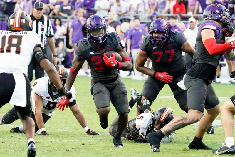 Oct 15, 2022; Fort Worth, Texas, USA; TCU Horned Frogs running back Kendre Miller (33) carries the ball in overtime against the Oklahoma State Cowboys during the second half at Amon G. Carter Stadium. Mandatory Credit: Raymond Carlin III-USA TODAY Sports