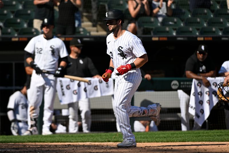 Aug 29, 2024; Chicago, Illinois, USA;  Chicago White Sox outfielder Andrew Benintendi (23)crosses home plate after he hits a home run against the Texas Rangers during the ninth inning at Guaranteed Rate Field. Mandatory Credit: Matt Marton-USA TODAY Sports