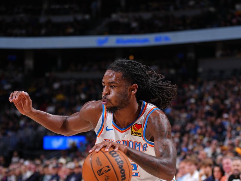 DENVER, CO - NOVEMBER 6: Cason Wallace #22 of the Oklahoma City Thunder dribbles the ball during the game against the Denver Nuggets on November 6, 2024 at Ball Arena in Denver, Colorado. NOTE TO USER: User expressly acknowledges and agrees that, by downloading and/or using this Photograph, user is consenting to the terms and conditions of the Getty Images License Agreement. Mandatory Copyright Notice: Copyright 2024 NBAE (Photo by Garrett Ellwood/NBAE via Getty Images)