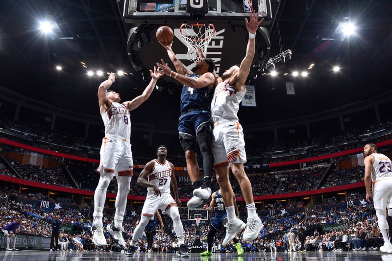 ORLANDO, FL - JANUARY 28: Jalen Suggs #4 of the Orlando Magic goes to the basket during the game on January 28, 2024 at Amway Center in Orlando, Florida. NOTE TO USER: User expressly acknowledges and agrees that, by downloading and or using this photograph, User is consenting to the terms and conditions of the Getty Images License Agreement. Mandatory Copyright Notice: Copyright 2024 NBAE (Photo by Fernando Medina/NBAE via Getty Images)