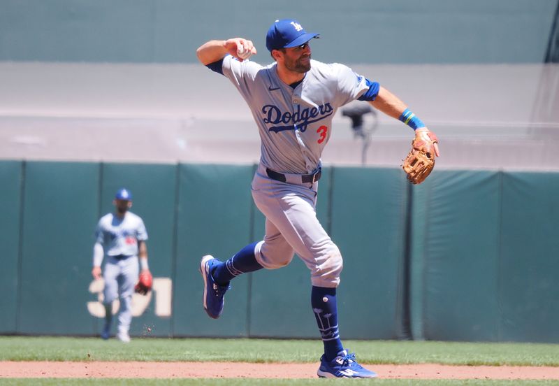 Jun 30, 2024; San Francisco, California, USA; Los Angeles Dodgers sthird baseman Chris Taylor (3) throws the ball to fire base against the San Francisco Giants during the fifth inning at Oracle Park. Mandatory Credit: Kelley L Cox-USA TODAY Sports