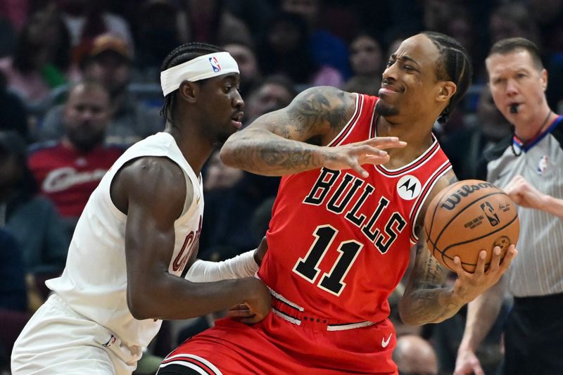 CLEVELAND, OHIO - JANUARY 15: DeMar DeRozan #11 of the Chicago Bulls drives to the basket against Caris LeVert #3 of the Cleveland Cavaliers during the first half at Rocket Mortgage Fieldhouse on January 15, 2024 in Cleveland, Ohio. NOTE TO USER: User expressly acknowledges and agrees that, by downloading and or using this photograph, User is consenting to the terms and conditions of the Getty Images License Agreement. (Photo by Nick Cammett/Getty Images)