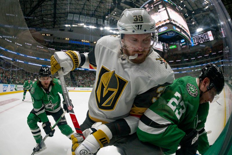 Apr 24, 2024; Dallas, Texas, USA; Vegas Golden Knights right wing Anthony Mantha (39) and Dallas Stars defenseman Esa Lindell (23) battle for control of the puck in the Stars zone in the first period in game two of the first round of the 2024 Stanley Cup Playoffs at American Airlines Center. Mandatory Credit: Jerome Miron-USA TODAY Sports