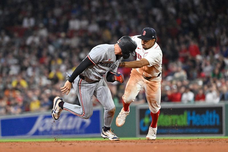 May 2, 2025; Boston, Massachusetts, USA; Boston Red Sox second baseman David Hamilton (17) chases Minnesota Twins second baseman Edouard Julien (47) to tag him out during the seventh inning at Fenway Park. Mandatory Credit: Eric Canha-Imagn Images