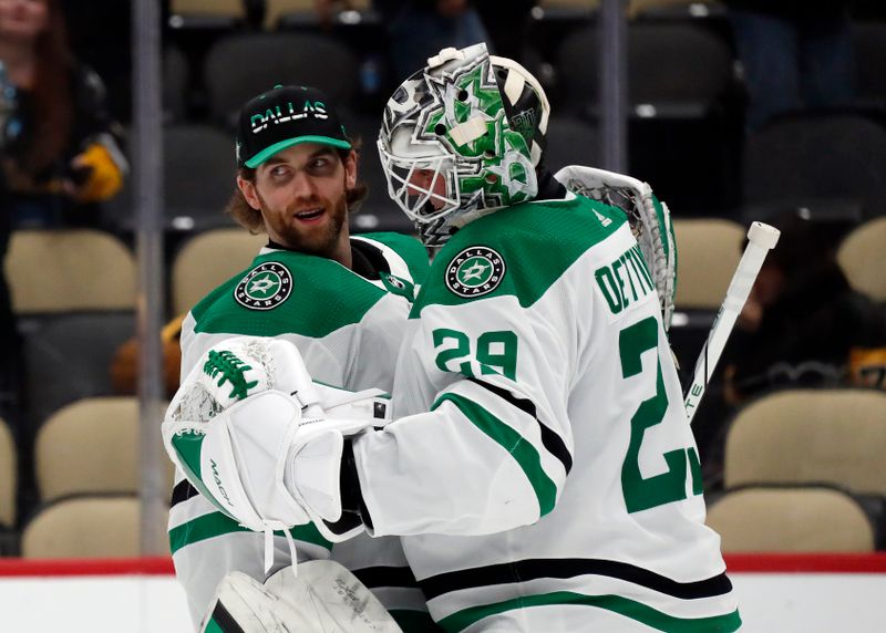 Oct 24, 2023; Pittsburgh, Pennsylvania, USA; Dallas Stars goaltender Scott Wedgewood (left) congratulates goaltender Jake Oettinger (29) after the Stars defeated the Pittsburgh Penguins at PPG Paints Arena. Dallas won 4-1. Mandatory Credit: Charles LeClaire-USA TODAY Sports