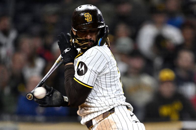 Apr 30, 2024; San Diego, California, USA; San Diego Padres right fielder Fernando Tatis Jr. (23) is hit by a pitch during the eighth inning against the Cincinnati Reds at Petco Park. Mandatory Credit: Orlando Ramirez-USA TODAY Sports