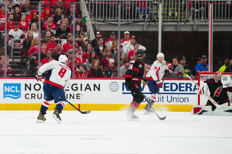 May 12, 2025; Raleigh, North Carolina, USA; Washington Capitals left wing Alex Ovechkin (8) scores a goal on his shot against the Carolina Hurricanes during the third period in game four of the second round of the 2025 Stanley Cup Playoffs at Lenovo Center. Mandatory Credit: James Guillory-Imagn Images