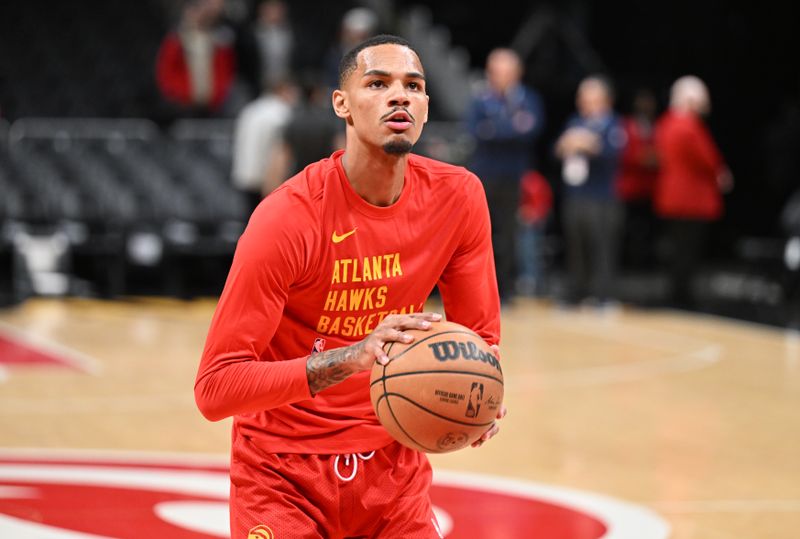 ATLANTA, GEORGIA - JANUARY 12: Dejounte Murray #5 of the Atlanta Hawks warms up before the game against the Indiana Pacers at State Farm Arena on January 12, 2024 in Atlanta, Georgia.  NOTE TO USER: User expressly acknowledges and agrees that, by downloading and or using this photograph, User is consenting to the terms and conditions of the Getty Images License Agreement. (Photo by Paras Griffin/Getty Images)