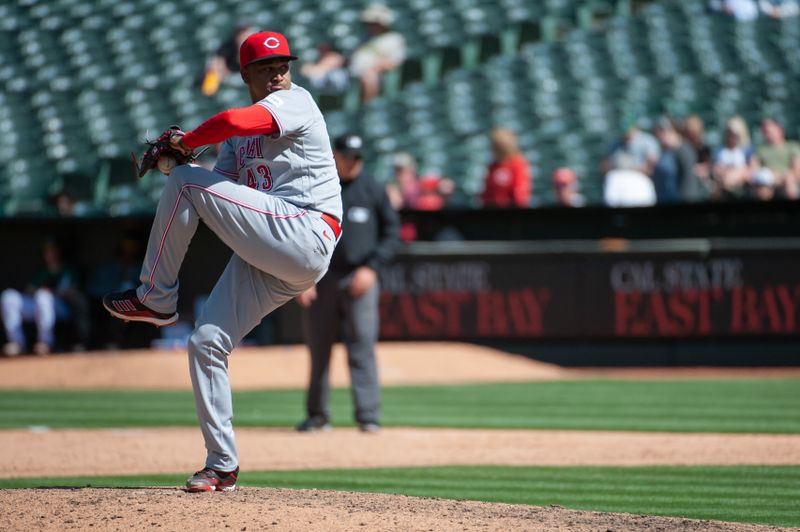 Apr 29, 2023; Oakland, California, USA; Cincinnati Reds relief pitcher Alexis Diaz (43) throws a pitch during the ninth inning against the Oakland Athletics at RingCentral Coliseum. Mandatory Credit: Ed Szczepanski-USA TODAY Sports