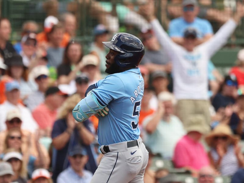 Mar 12, 2024; Sarasota, Florida, USA;  Tampa Bay Rays outfielder Randy Arozarena (56) celebrates hitting a home run during the fourth inning against the Baltimore Orioles at Ed Smith Stadium. Mandatory Credit: Kim Klement Neitzel-USA TODAY Sports