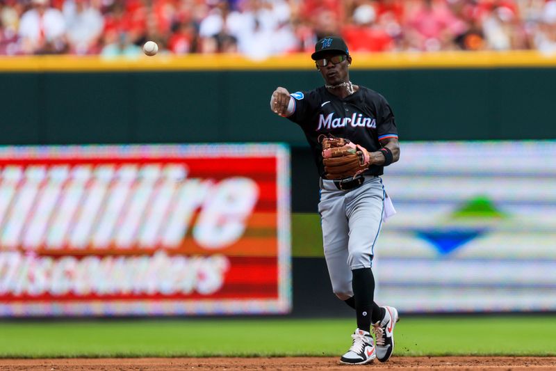 Jul 14, 2024; Cincinnati, Ohio, USA; Miami Marlins second baseman Jazz Chisholm Jr. (2) throw to first to get Cincinnati Reds third baseman Santiago Espinal (not pictured) out in the third inning at Great American Ball Park. Mandatory Credit: Katie Stratman-USA TODAY Sports