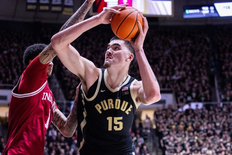 Feb 10, 2024; West Lafayette, Indiana, USA; Purdue Boilermakers center Zach Edey (15) shoots the ball while Indiana Hoosiers center Kel'el Ware (1) defends in the second half at Mackey Arena. Mandatory Credit: Trevor Ruszkowski-USA TODAY Sports