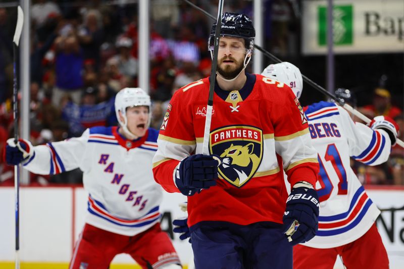 May 26, 2024; Sunrise, Florida, USA; Florida Panthers defenseman Oliver Ekman-Larsson (91) reacts after a game winning goal by New York Rangers center Alex Wennberg (91) during overtime in game three of the Eastern Conference Final of the 2024 Stanley Cup Playoffs at Amerant Bank Arena. Mandatory Credit: Sam Navarro-USA TODAY Sports