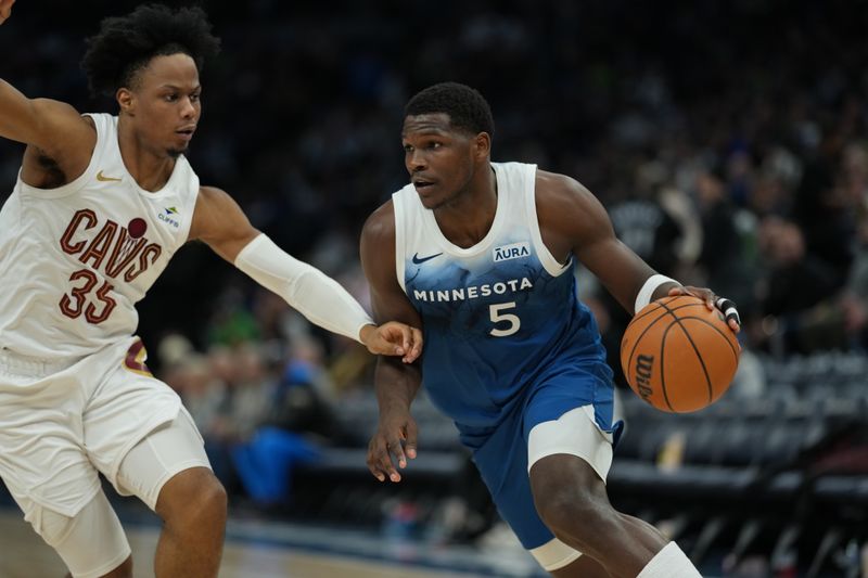 MINNEAPOLIS, MN -  MARCH 22: Anthony Edwards #5 of the Minnesota Timberwolves handles the ball during the game against the Cleveland Cavaliers on March 22, 2024 at Target Center in Minneapolis, Minnesota. NOTE TO USER: User expressly acknowledges and agrees that, by downloading and or using this Photograph, user is consenting to the terms and conditions of the Getty Images License Agreement. Mandatory Copyright Notice: Copyright 2024 NBAE (Photo by Jordan Johnson/NBAE via Getty Images)