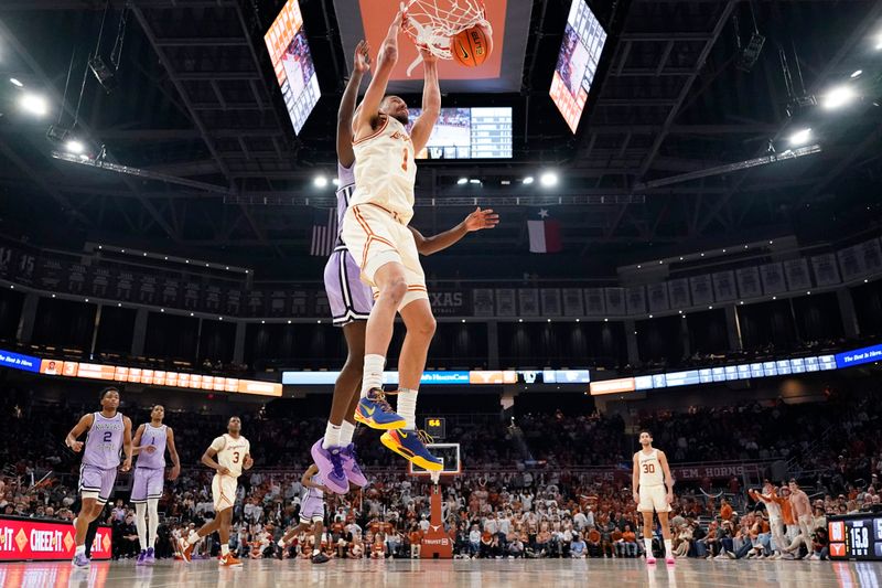 Feb 19, 2024; Austin, Texas, USA; Texas Longhorns forward Dylan Disu (1) dunks during the second half against the Kansas State Wildcats at Moody Center. Mandatory Credit: Scott Wachter-USA TODAY Sports