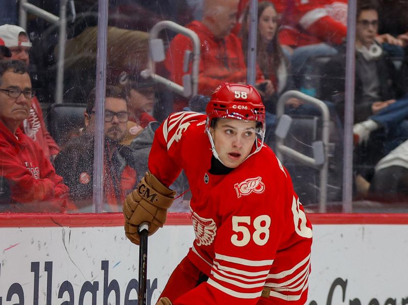 Nov 9, 2025; Detroit, Michigan, USA; Detroit Red Wings center Emmitt Finnie (58) handles the puck during the third period against the Chicago Blackhawks at Little Caesars Arena. Mandatory Credit: Brian Bradshaw Sevald-Imagn Images
