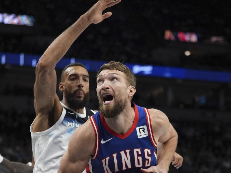MINNEAPOLIS, MN -  NOVEMBER 27:  Domantas Sabonis #11 of the Sacramento Kings drives to the basket during the game against the Minnesota Timberwolves on November 27, 2024 at Target Center in Minneapolis, Minnesota. NOTE TO USER: User expressly acknowledges and agrees that, by downloading and or using this Photograph, user is consenting to the terms and conditions of the Getty Images License Agreement. Mandatory Copyright Notice: Copyright 2024 NBAE (Photo by Jordan Johnson/NBAE via Getty Images)