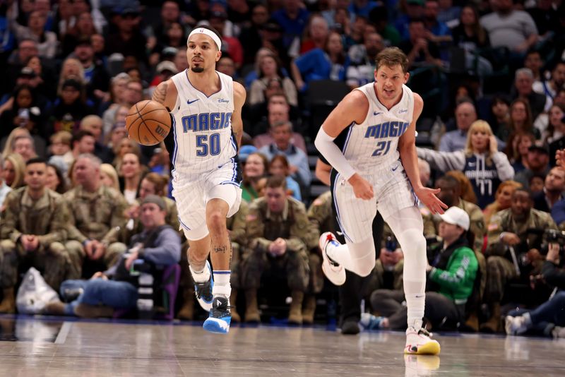 DALLAS, TEXAS - JANUARY 29: Cole Anthony #50 of the Orlando Magic dribbles the ball up court against the Dallas Mavericks in the first half at American Airlines Center on January 29, 2024 in Dallas, Texas. NOTE TO USER: User expressly acknowledges and agrees that, by downloading and or using this photograph, User is consenting to the terms and conditions of the Getty Images License Agreement. (Photo by Tim Heitman/Getty Images)