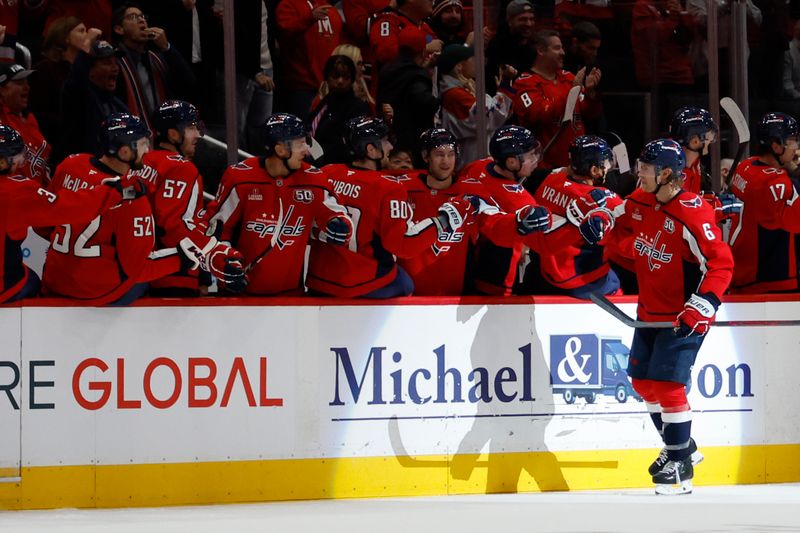 Oct 15, 2024; Washington, District of Columbia, USA; Washington Capitals defenseman Jakob Chychrun (6) celebrates with teammates after scoring a goal against the Vegas Golden Knights in the second period at Capital One Arena. Mandatory Credit: Geoff Burke-Imagn Images