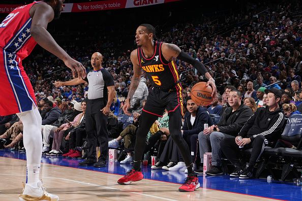 PHILADELPHIA, PA - DECEMBER 8: Dejounte Murray #5 of the Atlanta Hawks dribbles the ball during the game against the Philadelphia 76ers on December 8, 2023 at the Wells Fargo Center in Philadelphia, Pennsylvania NOTE TO USER: User expressly acknowledges and agrees that, by downloading and/or using this Photograph, user is consenting to the terms and conditions of the Getty Images License Agreement. Mandatory Copyright Notice: Copyright 2023 NBAE (Photo by Jesse D. Garrabrant/NBAE via Getty Images)