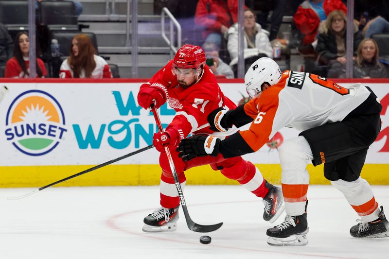 Dec 22, 2023; Detroit, Michigan, USA;  Detroit Red Wings center Dylan Larkin (71) skates with the puck defended by Philadelphia Flyers defenseman Travis Sanheim (6) in the second period at Little Caesars Arena. Mandatory Credit: Rick Osentoski-USA TODAY Sports